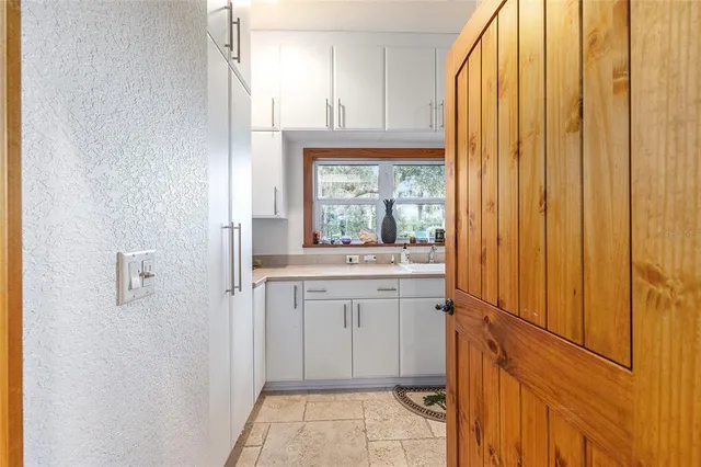 a spacious bathroom with a granite countertop sink mirror and a shower