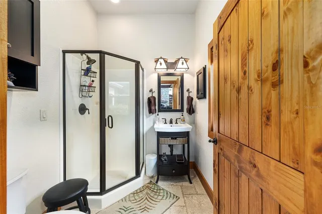 an aerial view of a house with a yard and balcony
