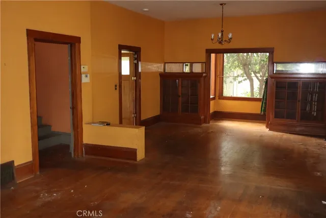 a view of hallway with chandelier and entryway