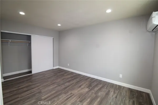 a view of room with wooden floor