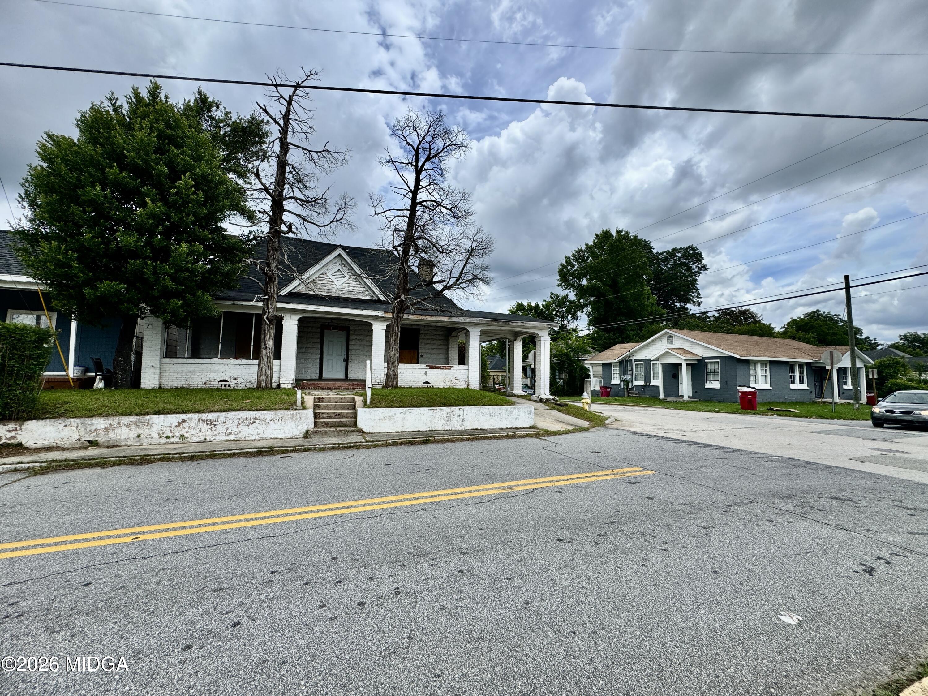1905 3rd Avenue Macon, GA 31201 - Photo 18 of 27 a front view of a house with a garden and yard