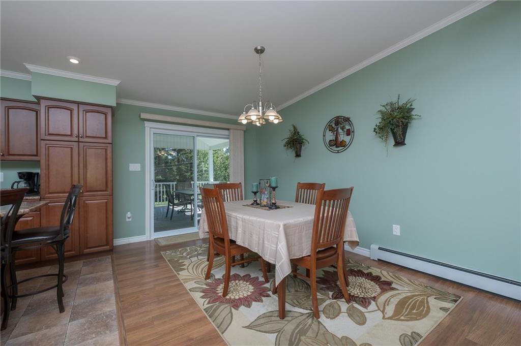 239 Main Street St. Agatha, ME 04772 - Photo 9 of 35 Dining Area and Sliders to the Back Deck