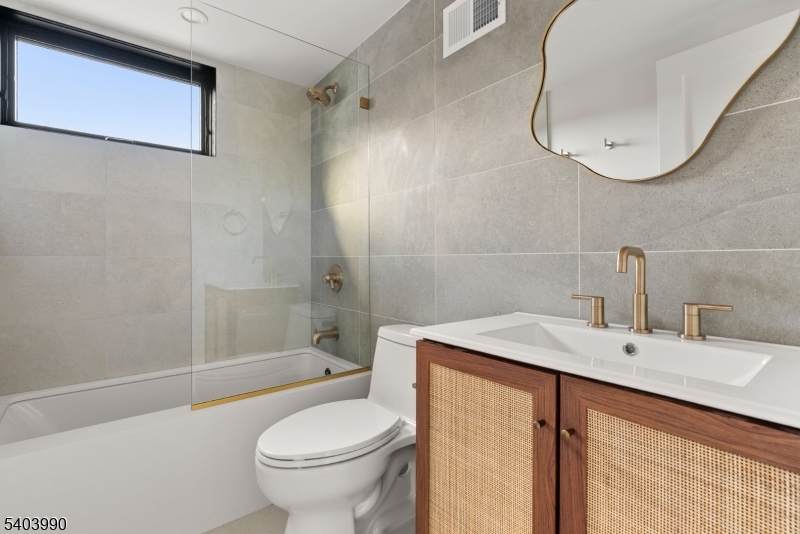 112 Valley Road, Unit B Montclair, NJ 07042 - Photo 14 of 18 a bathroom with a sink a toilet and shower