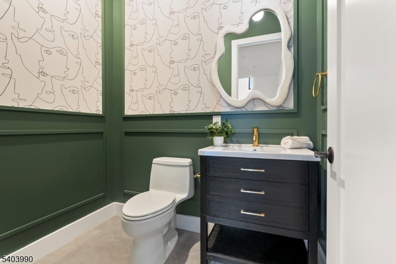 112 Valley Road, Unit B Montclair, NJ 07042 - Photo 15 of 18 a bathroom with a toilet sink and mirror