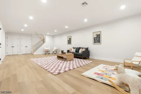 a living room with furniture and a rug