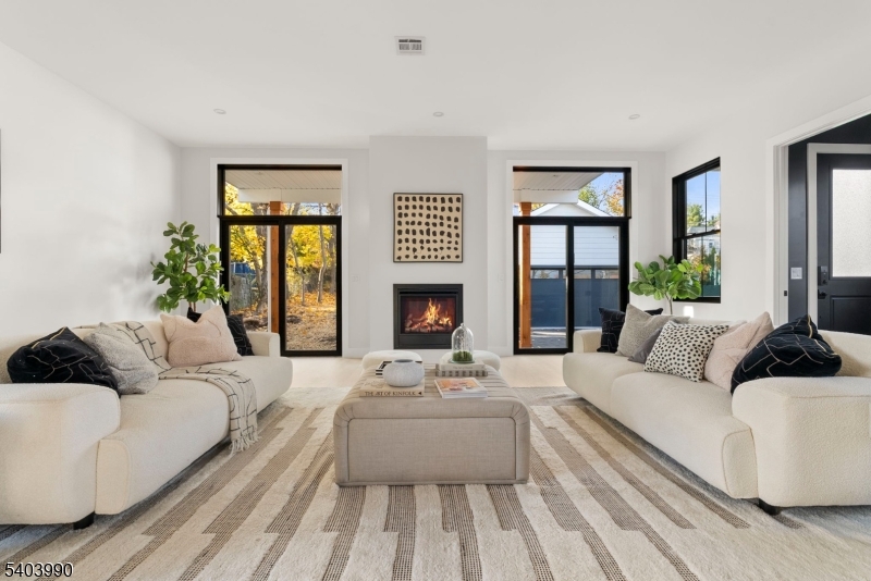 112 Valley Road, Unit B Montclair, NJ 07042 - Photo 2 of 18 a living room with furniture fireplace and a large window
