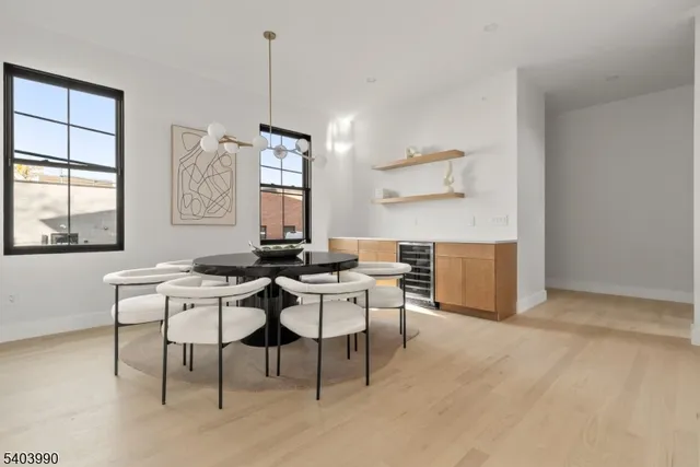 a view of a dining room with furniture and window