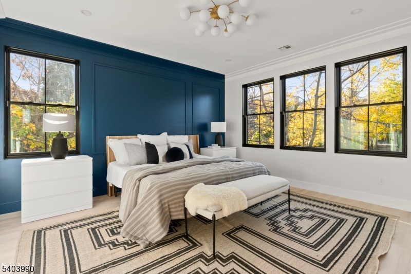 112 Valley Road, Unit B Montclair, NJ 07042 - Photo 5 of 18 a spacious bedroom with a bed and a large window