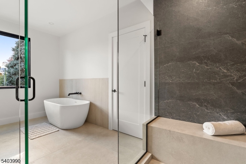 112 Valley Road, Unit B Montclair, NJ 07042 - Photo 7 of 18 a bathroom with a bathtub and shower