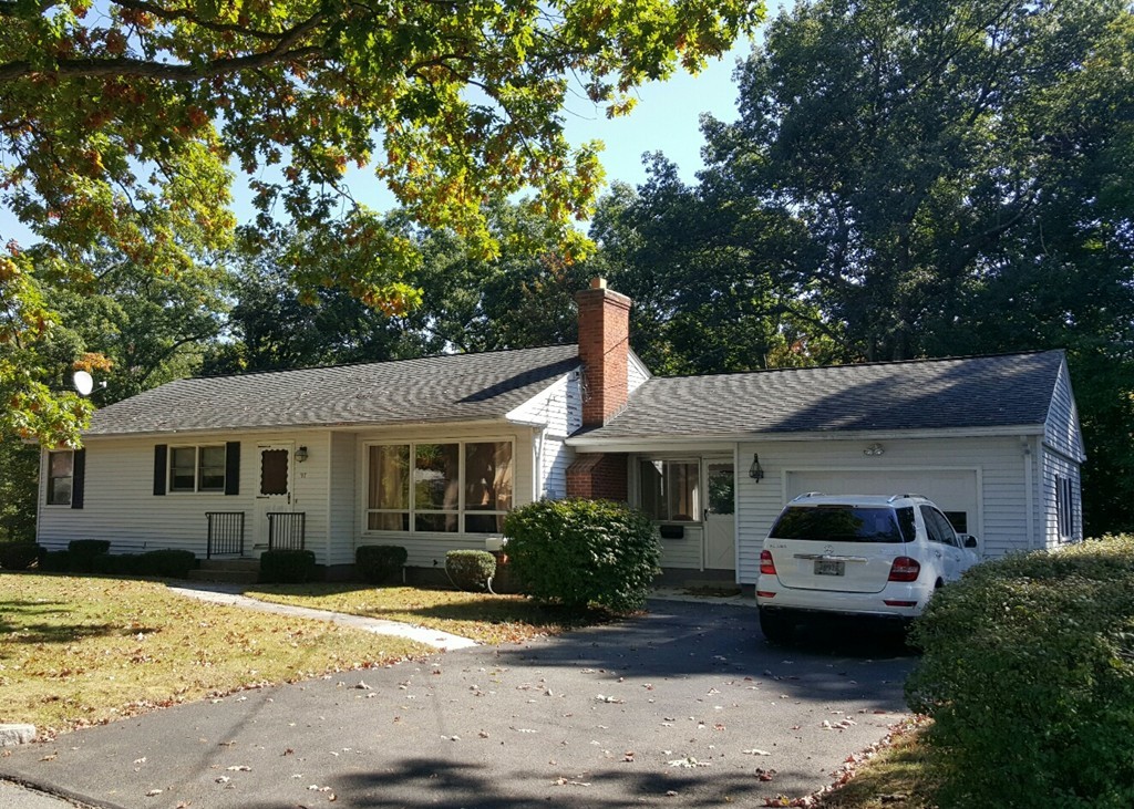 97 Bremen Street Springfield, MA 01108 - Photo 1 of 7 a front view of a house with a yard