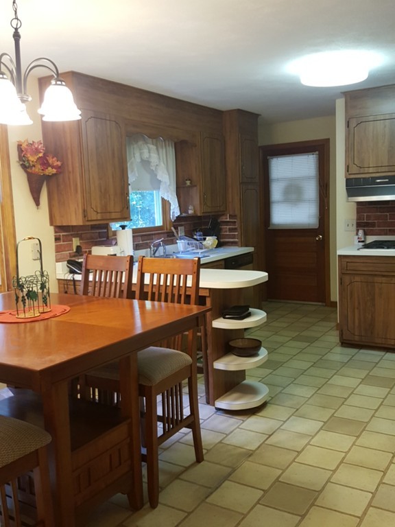 97 Bremen Street Springfield, MA 01108 - Photo 6 of 7 a kitchen with a sink and a stove in it