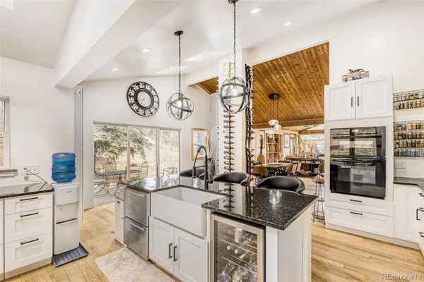 a living room with furniture a rug and a large window