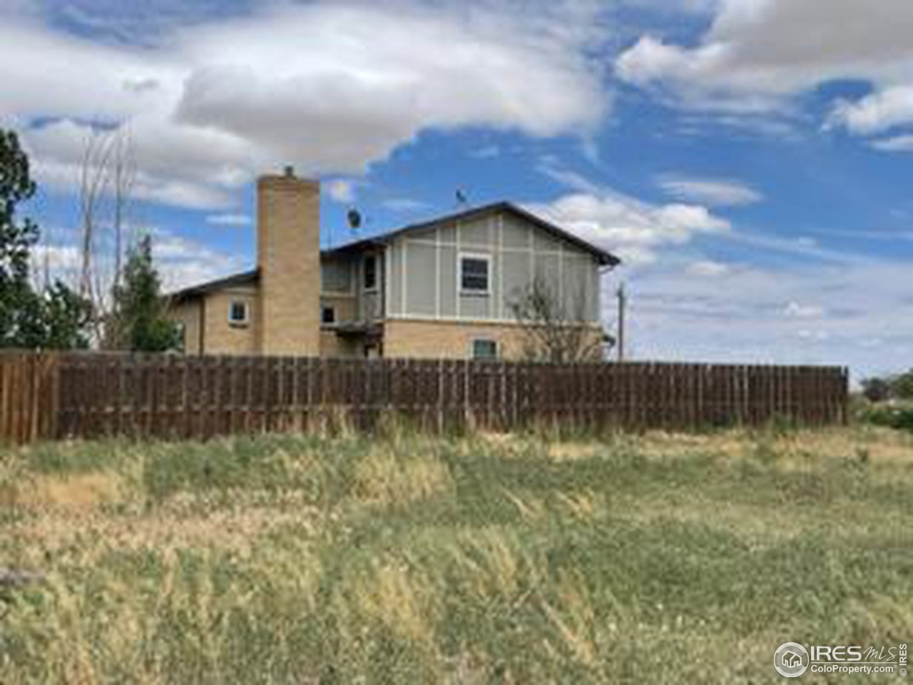 10415 North Converse Road, Unit 10415 Bennett, CO 80102 - Photo 3 of 23 Fence enclosed Residence