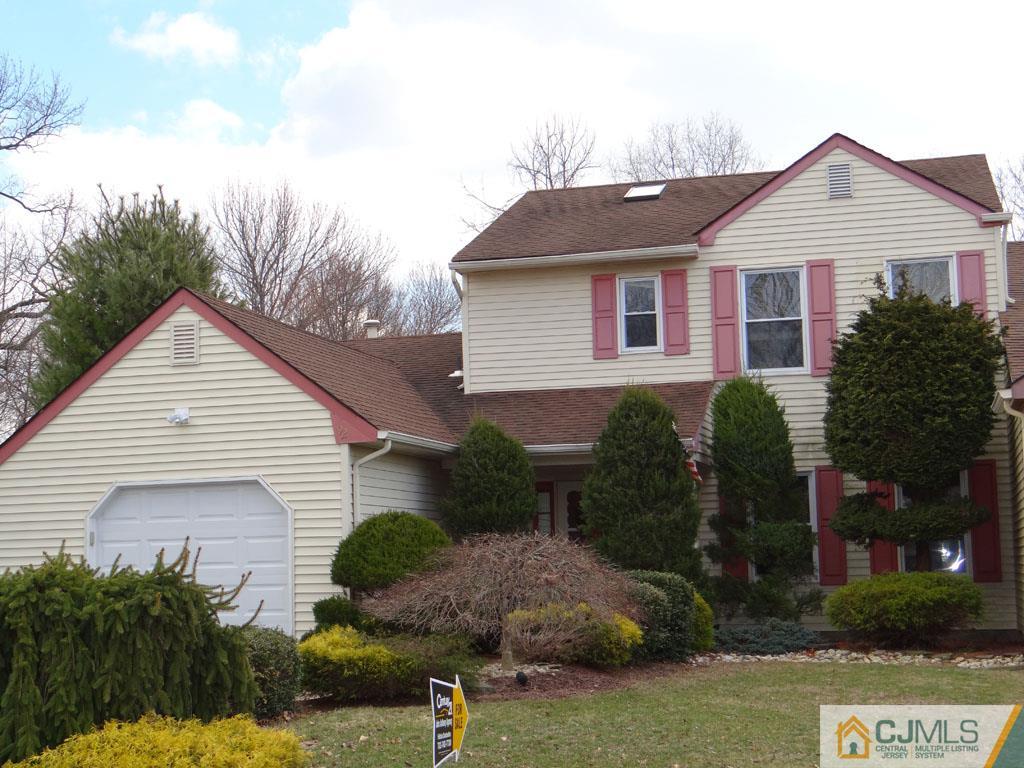 92 Woodbury Road Edison, NJ 08820 - Photo 1 of 16 a front view of a house with garden