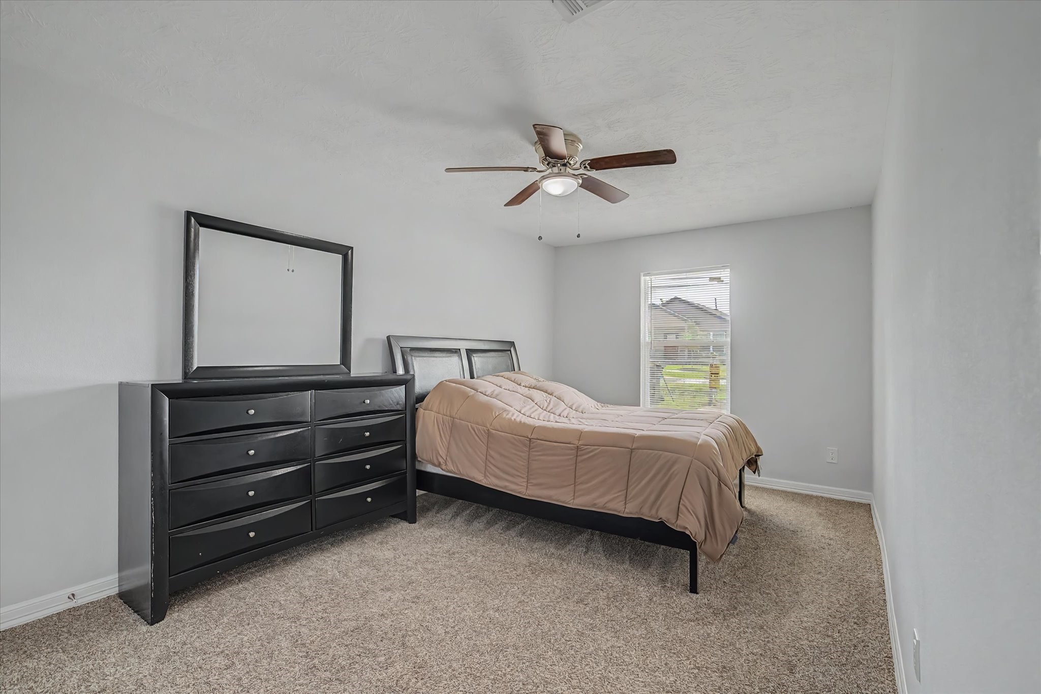 6834 New York Street Houston, TX 77021 - Photo 33 of 39 Bedroom 4, Versatile bedroom space boasting excellent natural light from the window and a built in closet for easy storage.