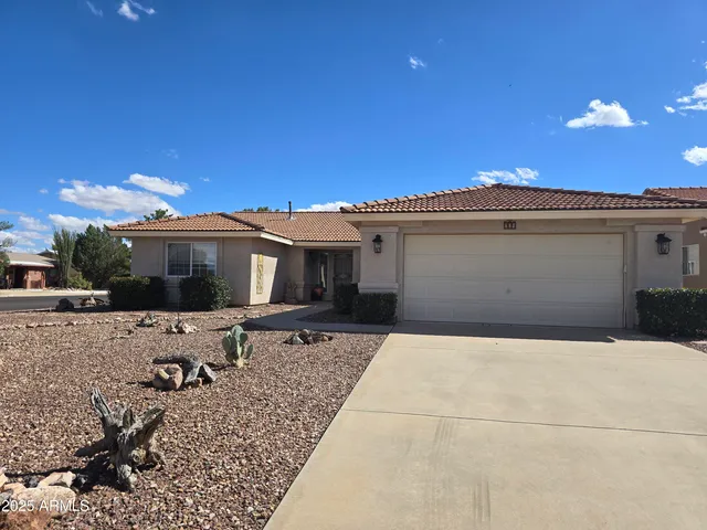 a view of a terrace with chairs and potted plants