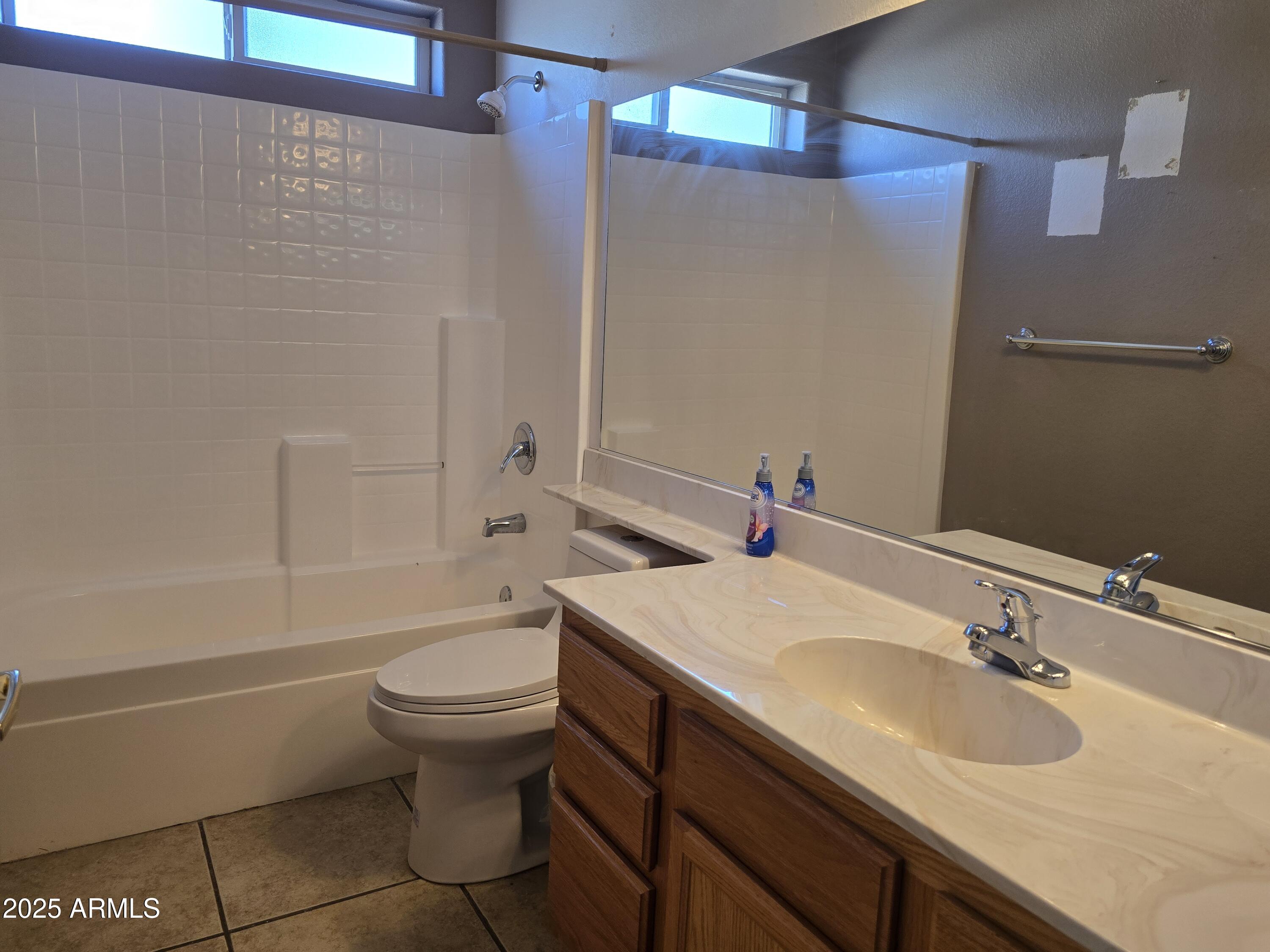 924 West Sahuaro Road Pearce, AZ 85625 - Photo 18 of 32 a bathroom with a sink a toilet and shower