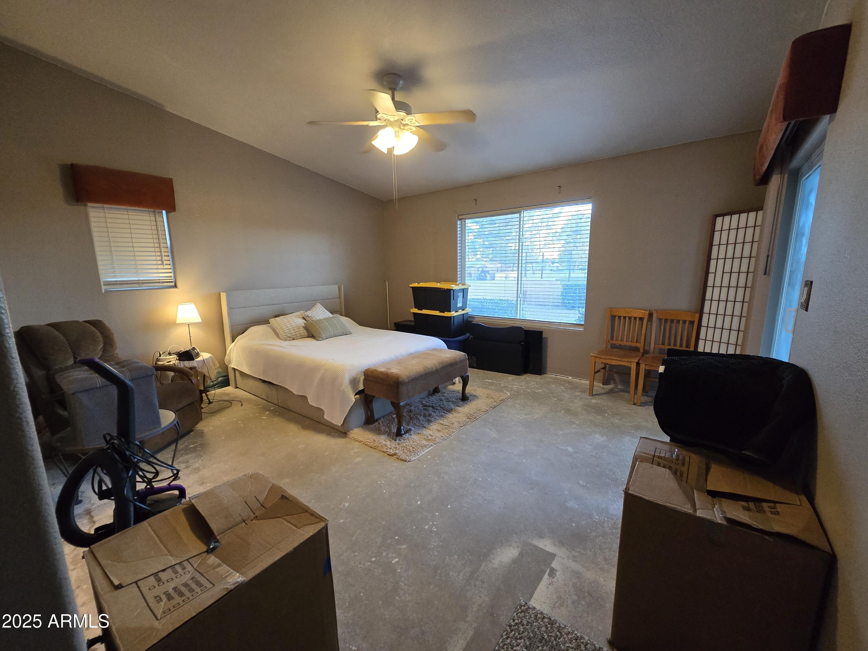 924 West Sahuaro Road Pearce, AZ 85625 - Photo 21 of 32 a bedroom with two beds and a chair