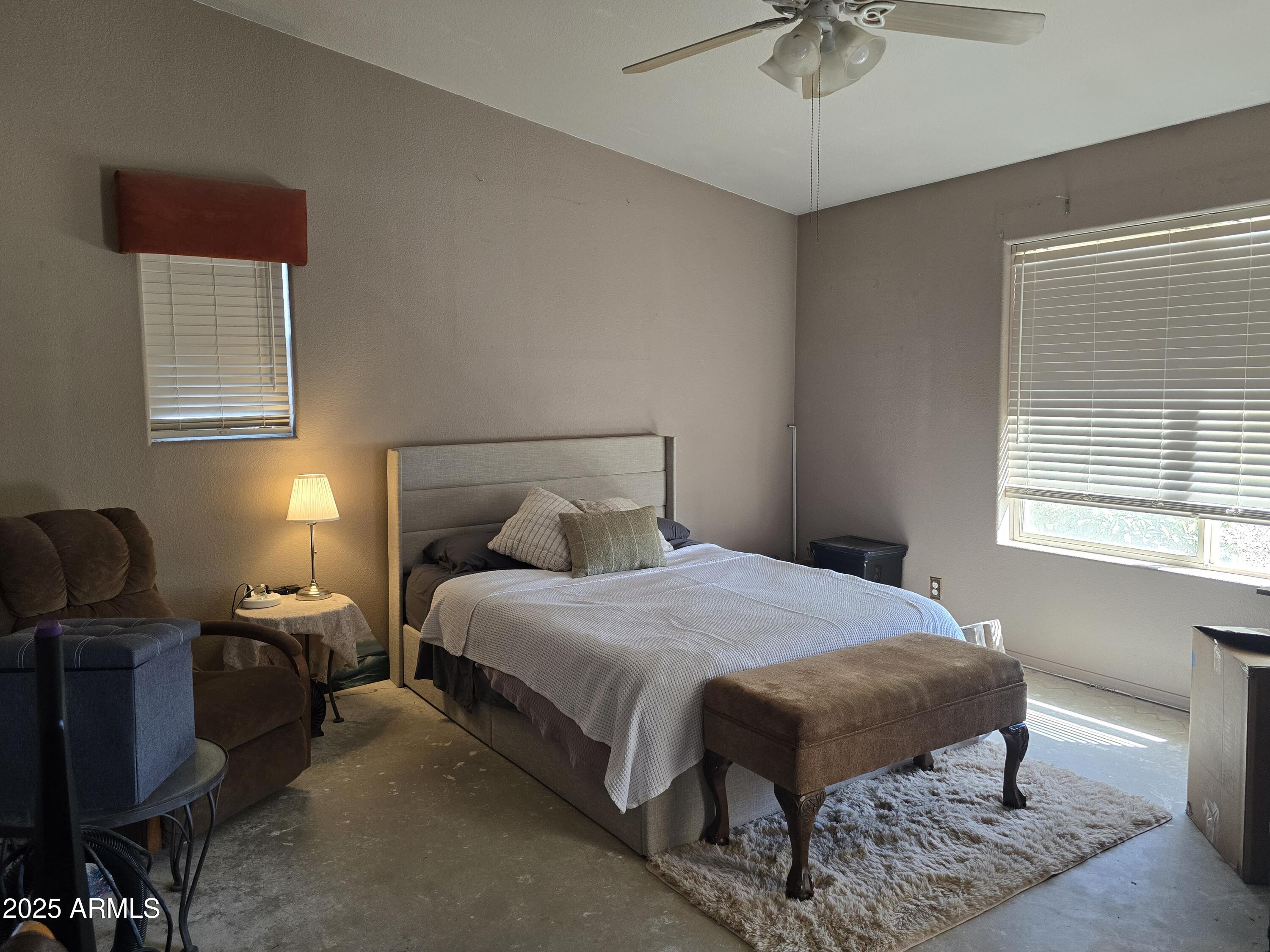924 West Sahuaro Road Pearce, AZ 85625 - Photo 22 of 32 a bedroom with a bed and window