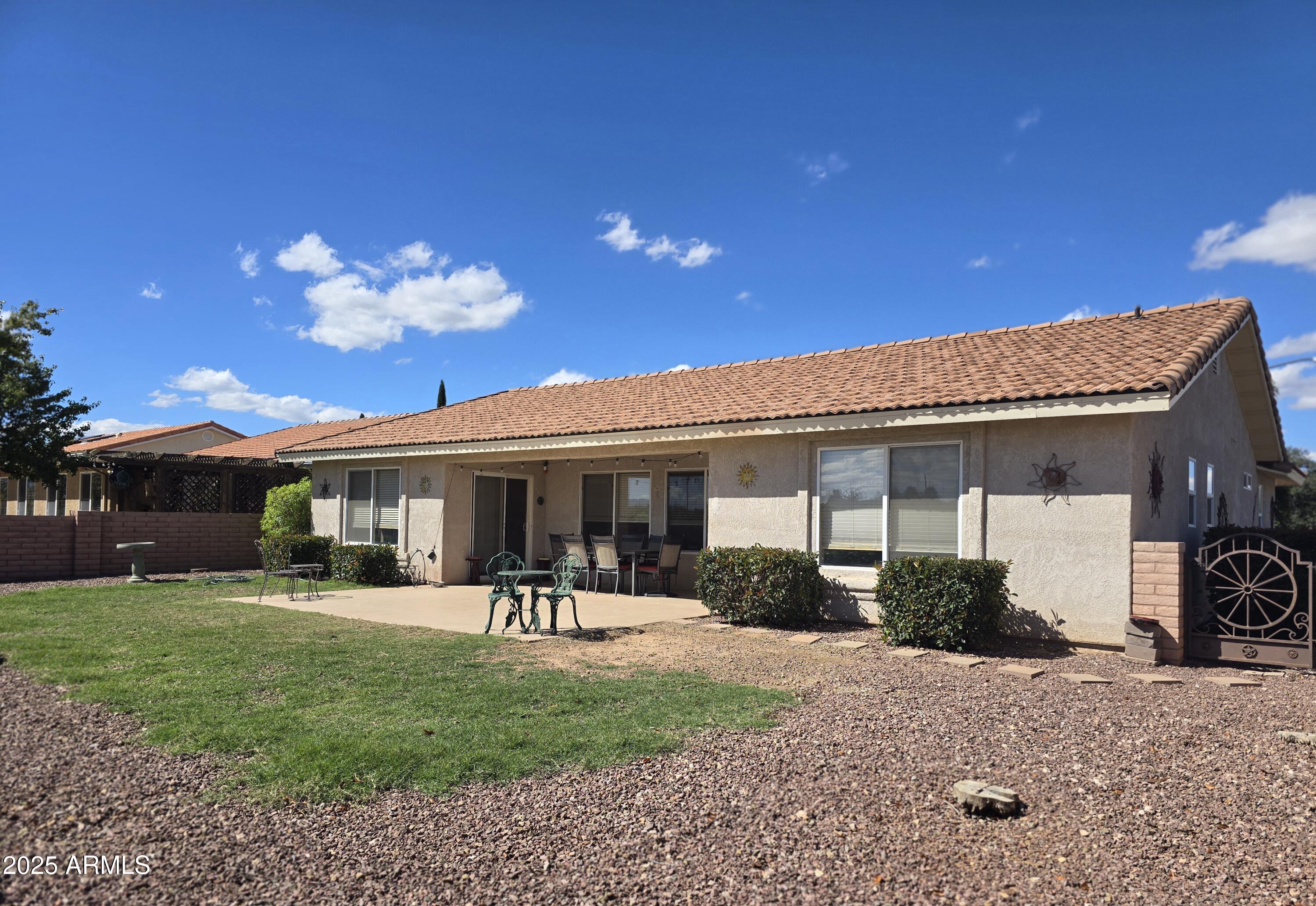 924 West Sahuaro Road Pearce, AZ 85625 - Photo 26 of 32 a front view of a house with garden