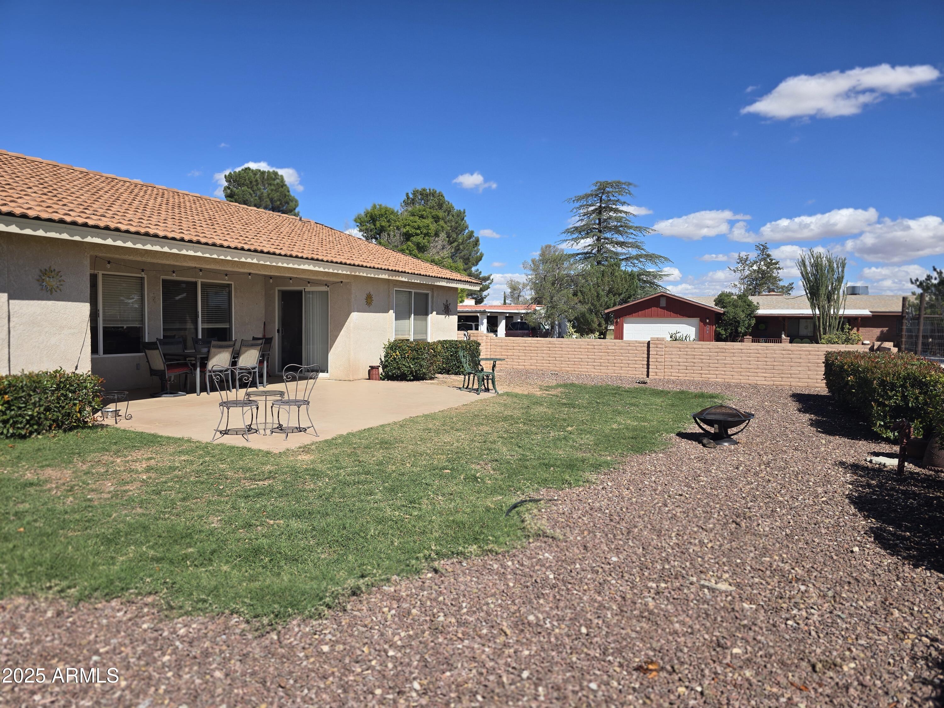 924 West Sahuaro Road Pearce, AZ 85625 - Photo 28 of 32 a view of a house with backyard porch and sitting area