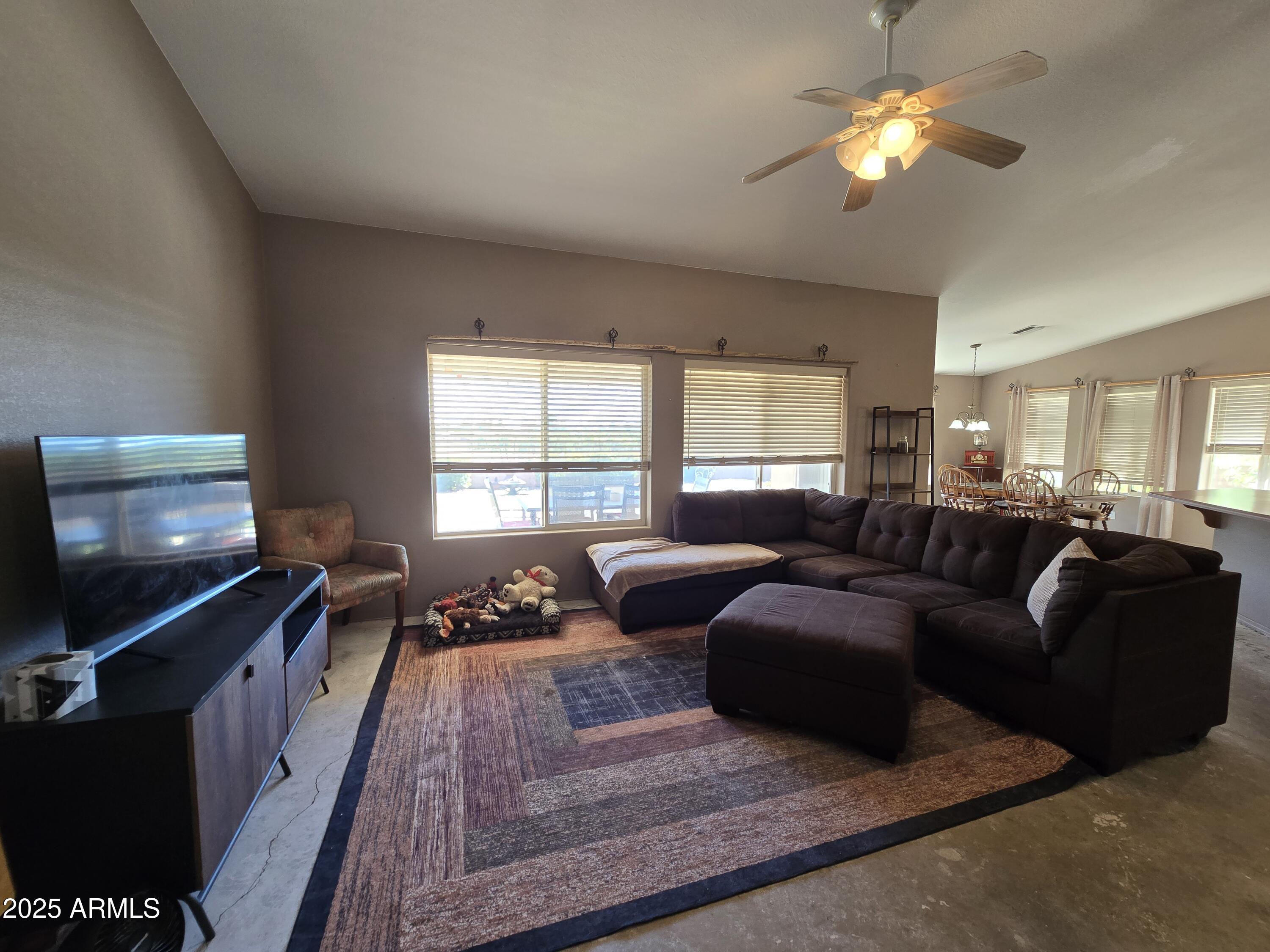 924 West Sahuaro Road Pearce, AZ 85625 - Photo 4 of 32 a living room with furniture and a flat screen tv