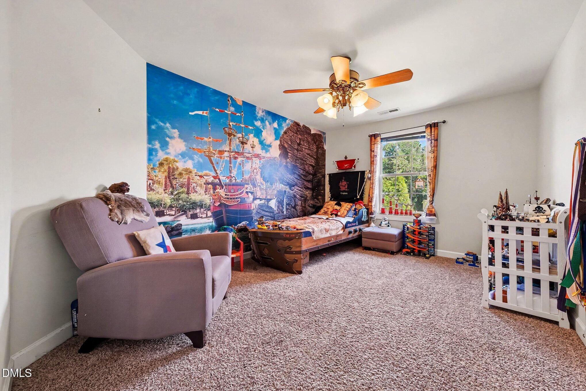 4000 Banks Stone Drive Raleigh, NC 27603 - Photo 27 of 60 a living room with furniture and a chandelier