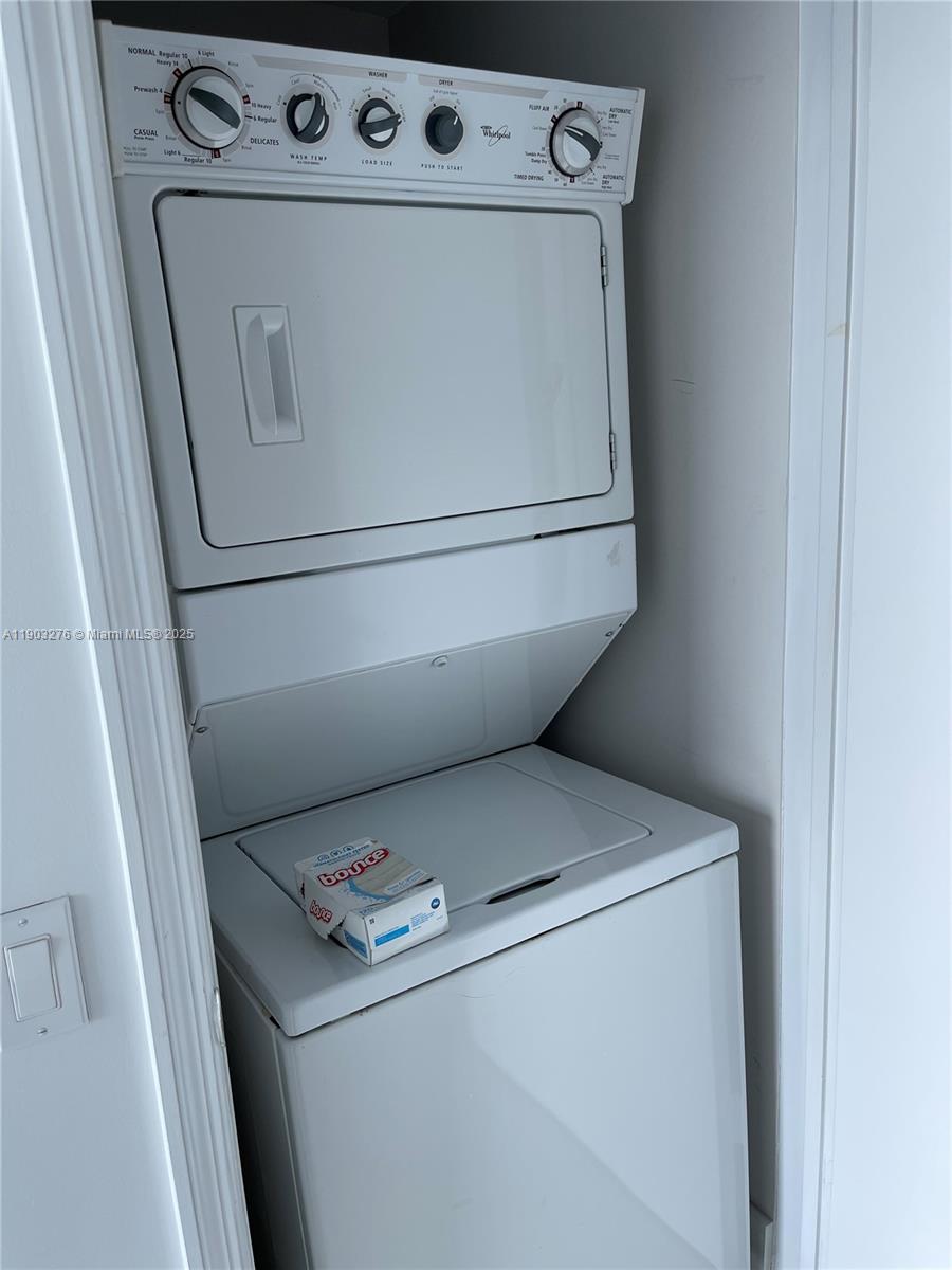 60 Southwest 13th Street, Unit 2213 Miami, FL 33130 - Photo 12 of 19 a utility room with dryer and washer
