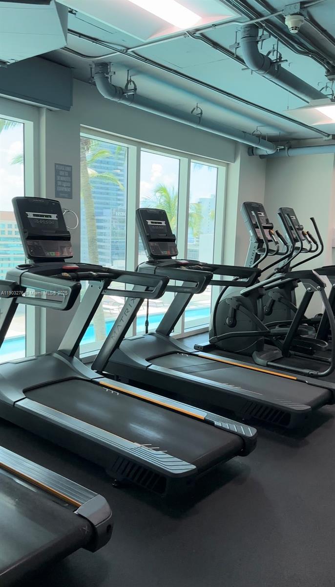 60 Southwest 13th Street, Unit 2213 Miami, FL 33130 - Photo 19 of 19 a view of a room with gym equipment