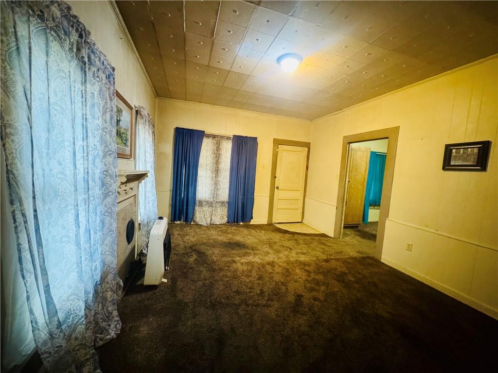 112 Cemetery Street Kingston, GA 30145 - Photo 12 of 28 a view of an empty room with a fireplace