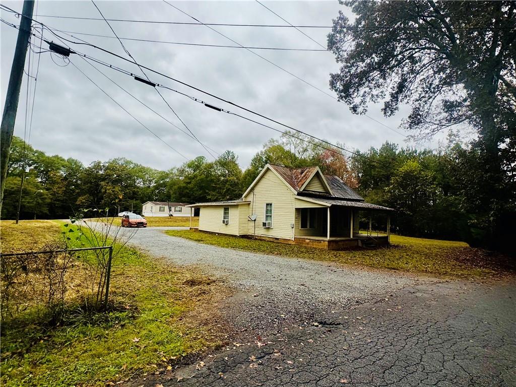 112 Cemetery Street Kingston, GA 30145 - Photo 19 of 28 a view of a house with a yard