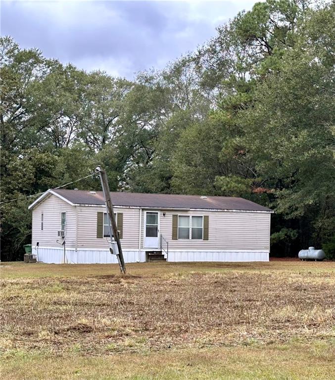 112 Cemetery Street Kingston, GA 30145 - Photo 21 of 28 a front view of a house with a yard