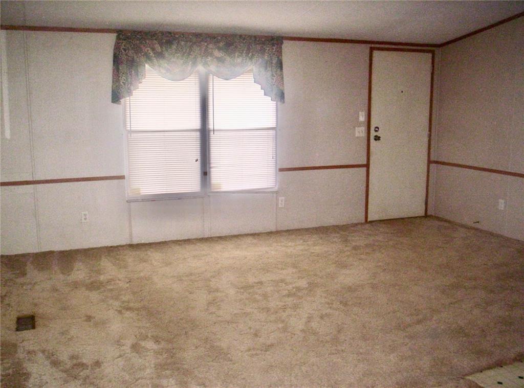 112 Cemetery Street Kingston, GA 30145 - Photo 22 of 28 a view of an empty room with a window