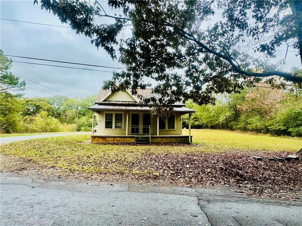 112 Cemetery Street Kingston, GA 30145 - Photo 3 of 28 a front view of a house with a yard