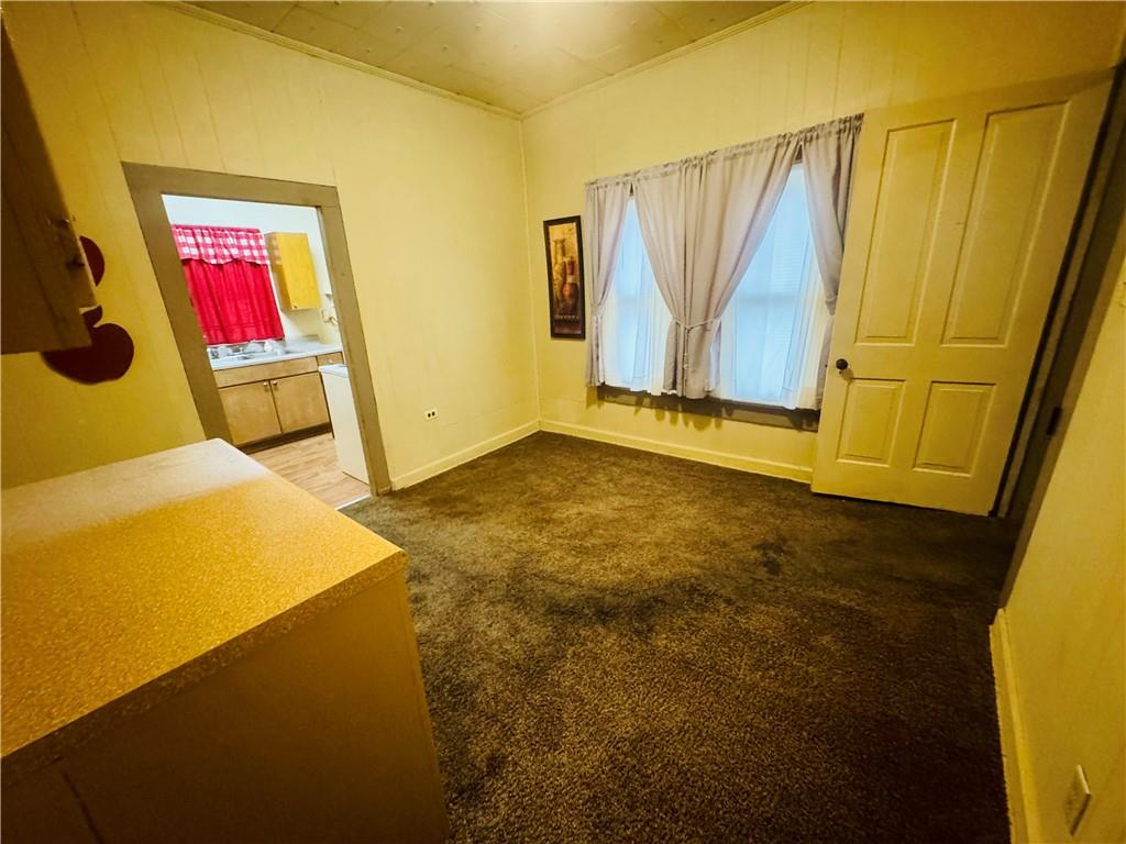 112 Cemetery Street Kingston, GA 30145 - Photo 6 of 28 a view of a room with wooden floor and cabinet