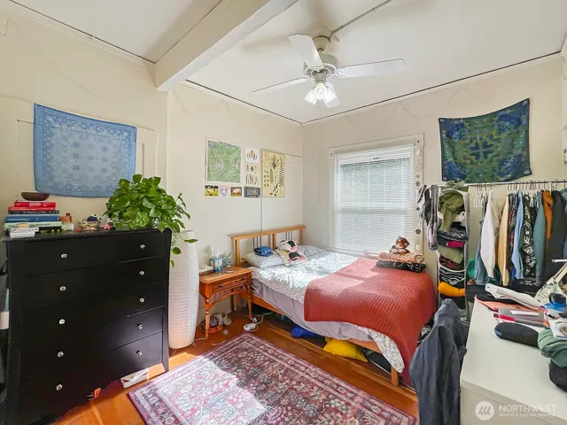 a bedroom with furniture and a window