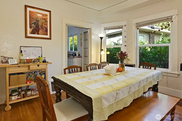 a view of a dining room with furniture window and wooden floor