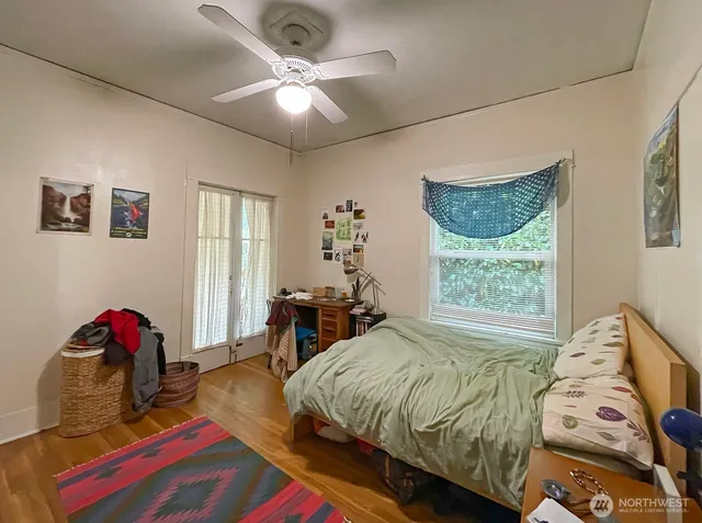 a bed room with a bed and a chandelier