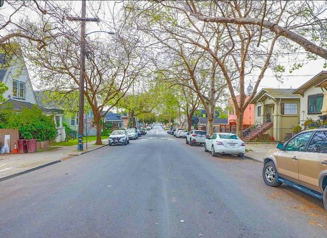 a view of a street with cars on road