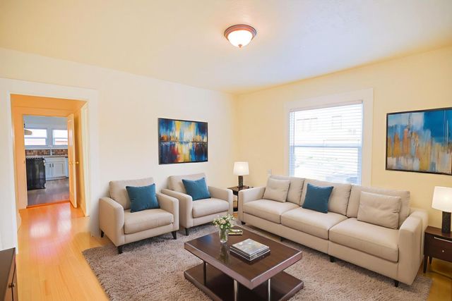 a living room with furniture and a couch