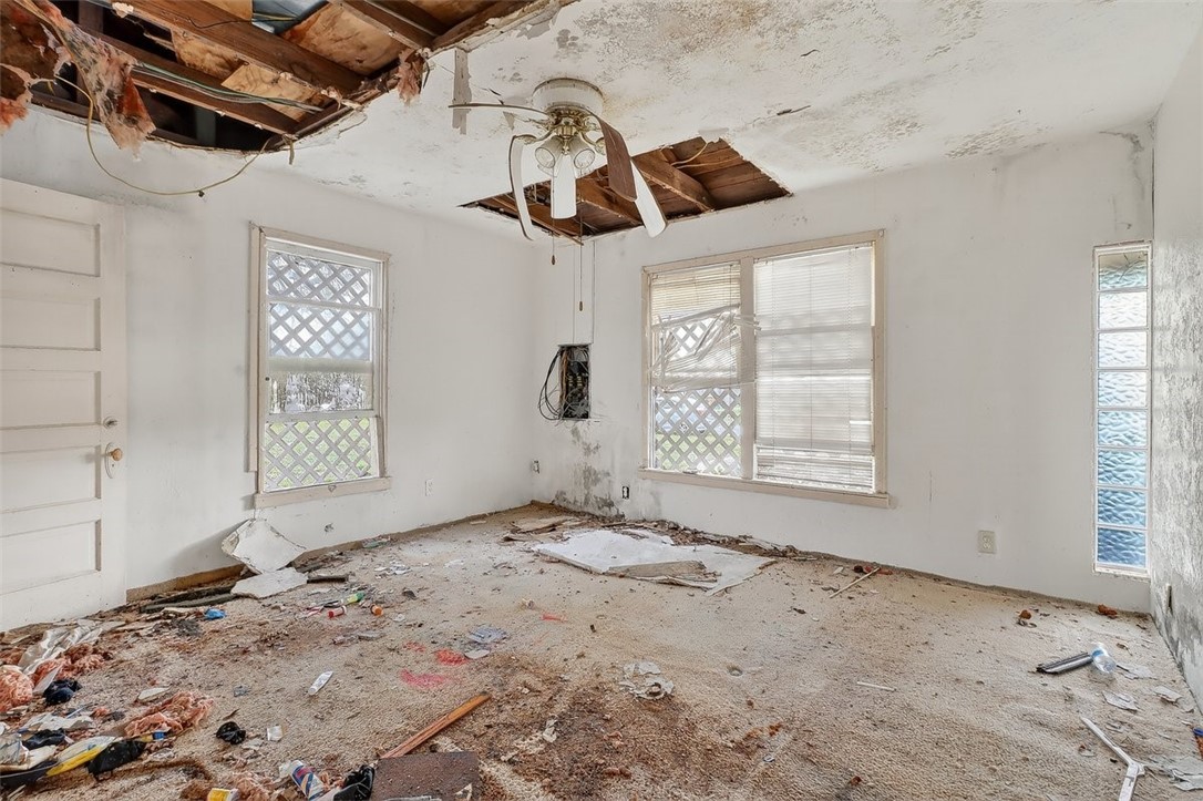1930 Sandy Way Corpus Christi, TX 78418 - Photo 14 of 35 a view of a bedroom with a bed and a window