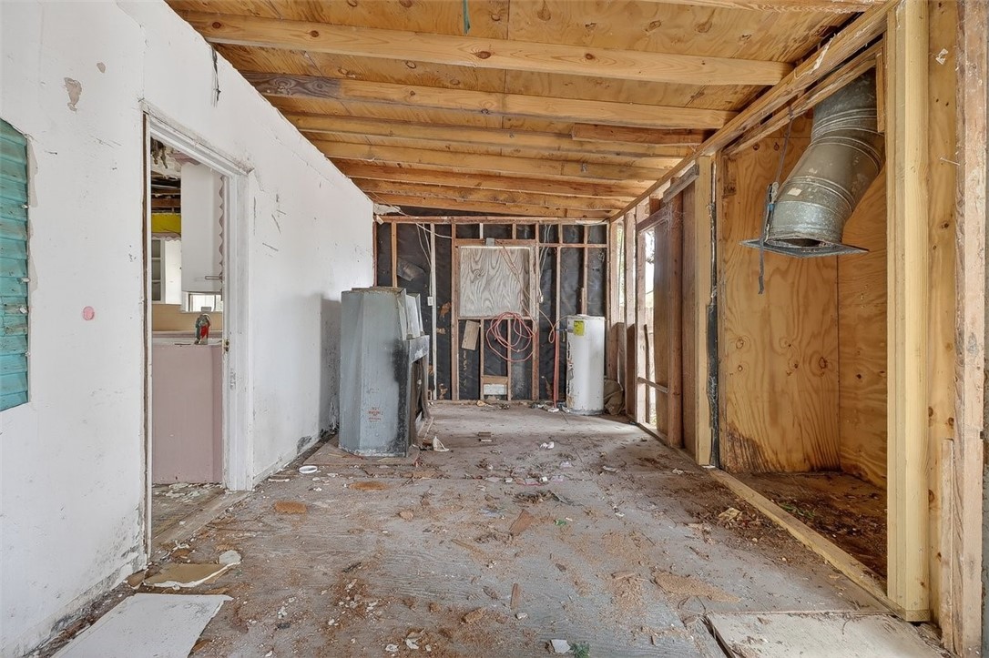 1930 Sandy Way Corpus Christi, TX 78418 - Photo 18 of 35 a view of a hallway with wooden walls