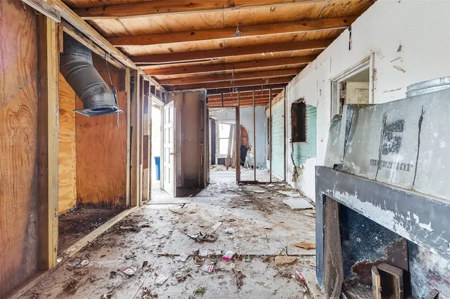 a view of a backyard door with a chair and table in the patio