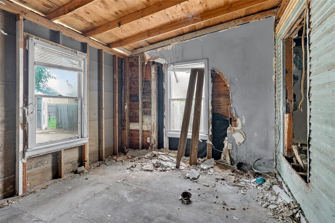 1930 Sandy Way Corpus Christi, TX 78418 - Photo 20 of 35 a view of a backyard door with a chair and table in the patio