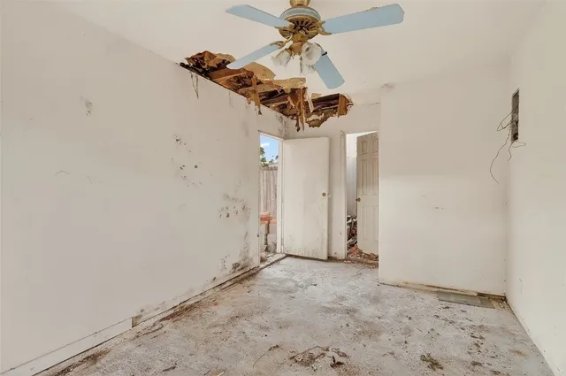 a view of a house with a yard and tree