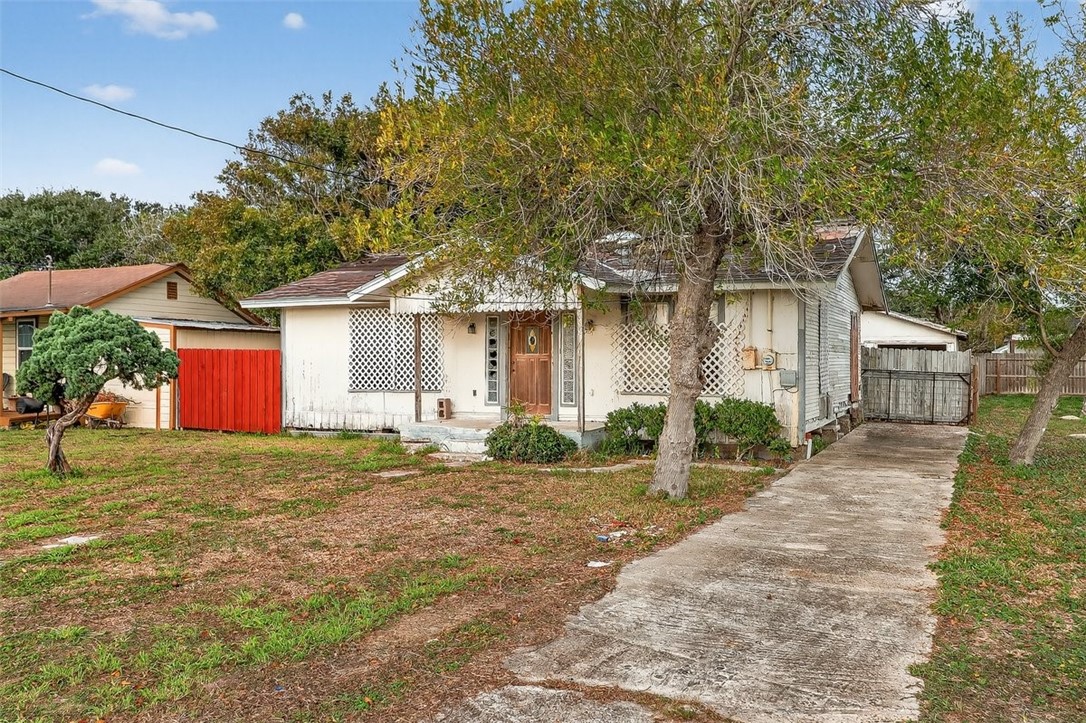 1930 Sandy Way Corpus Christi, TX 78418 - Photo 33 of 35 a front view of a house with a yard and garage