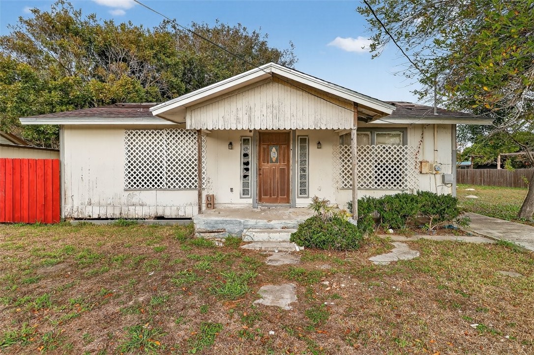 1930 Sandy Way Corpus Christi, TX 78418 - Photo 34 of 35 a front view of a house with a yard