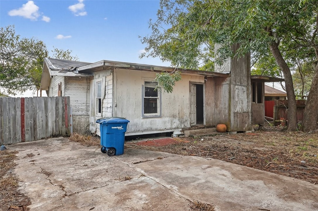 1930 Sandy Way Corpus Christi, TX 78418 - Photo 35 of 35 a backyard of a house with barbeque oven fire pit table and chairs