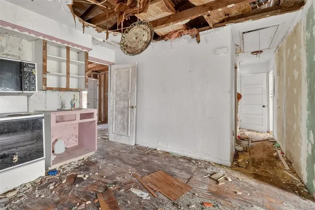 a view of a hallway with a chandelier