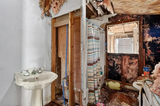a bathroom with a sink and mirror